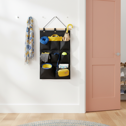Black hanging wall organizer with lightweight entryway accessories near a colorful door