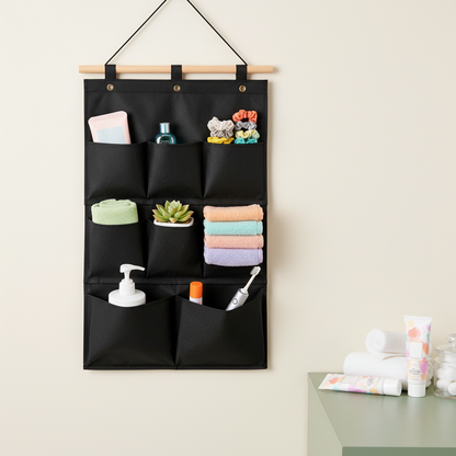 Black hanging wall organizer with eight pockets in a colorful bathroom setting