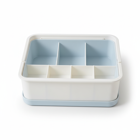Empty white and pale blue seven-section desktop organizer bin on a pure white background